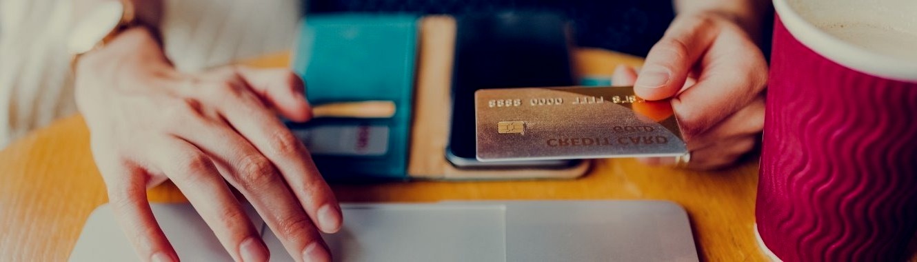 woman with credit card making online purchase - to be used for Personal Credit Card header photo